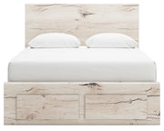 Signature Design by Ashley Lawroy panel bed with built-in storage drawers in a modern bedroom setting.