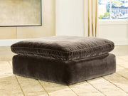 Benchcraft® Maxton Heights oversized accent ottoman with plush fabric and tufted top, perfect for additional seating or decor.