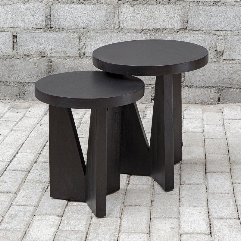 Uttermost Nadette nesting tables set of 2 with sleek glass tops and metal frames, ideal for versatile living room decor.