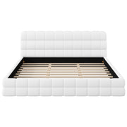 Dreamland upholstered platform bed with a padded headboard, showcasing a modern design and soft fabric upholstery.
