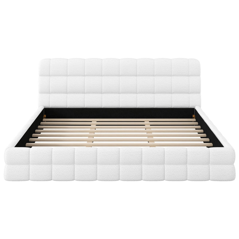 Dreamland upholstered platform bed with a padded headboard, showcasing a modern design and soft fabric upholstery.