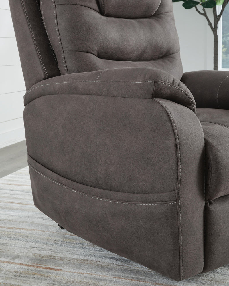 Signature Design by Ashley Snowfield Power Lift Recliner in Gunmetal, featuring plush cushioning and a sturdy lift mechanism.