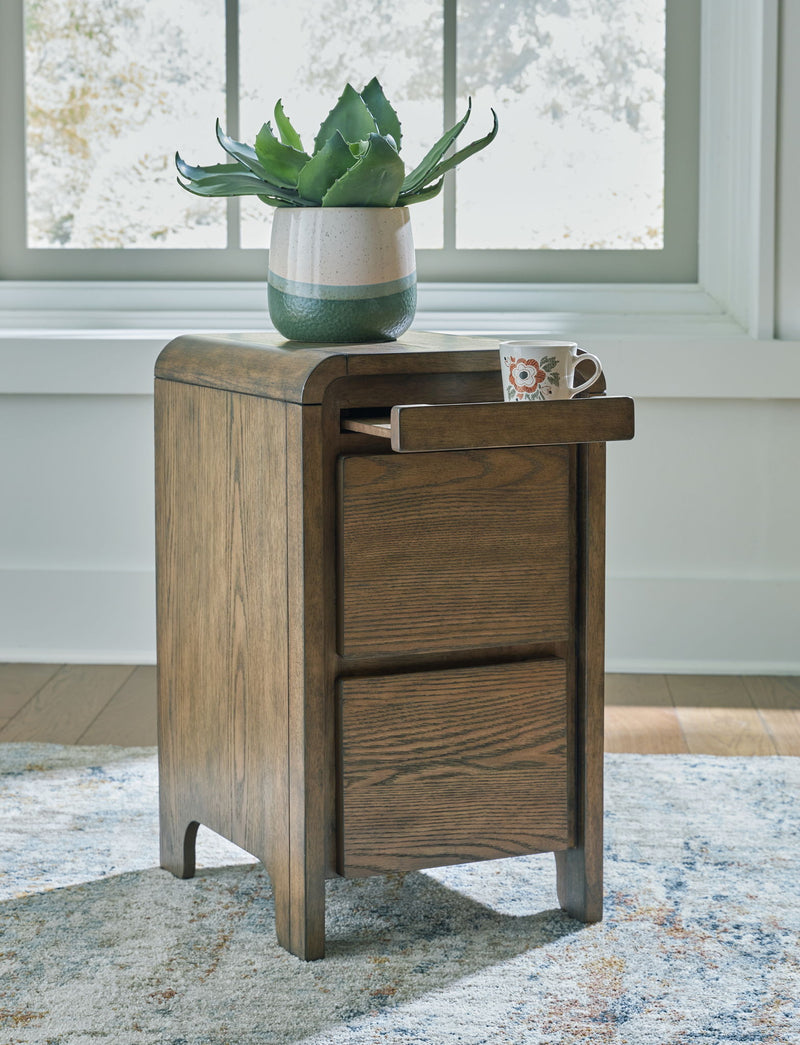 Brown Jensworth Accent Table by Signature Design by Ashley, showcasing a sleek wooden surface and modern accent style.