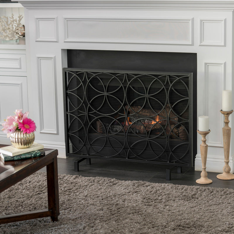 Noble House Thayer single panel iron fireplace screen with a geometric design, providing stylish protection for the fireplace.