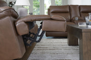 Signature Design by Ashley Vonryan power reclining loveseat with console, adjustable headrests, in tobacco fabric, showing comfortable seating.