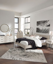 Signature Design by Ashley Socalle 3-piece bedroom set with bed, dresser, and nightstand in a modern bedroom scene.