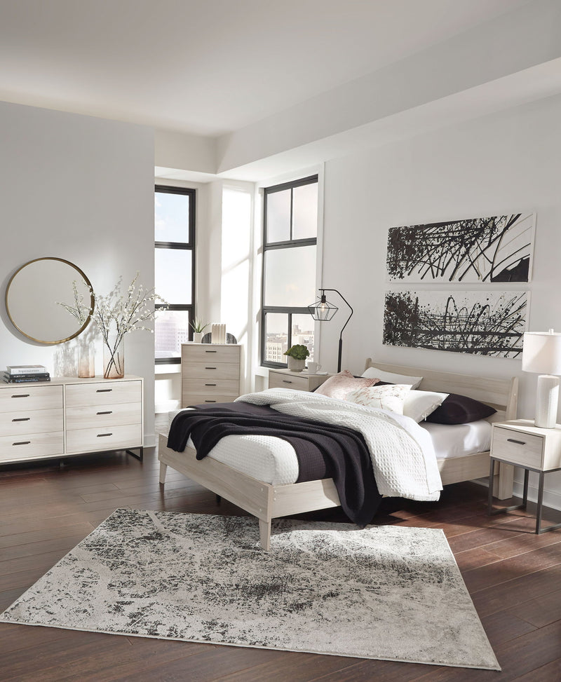Signature Design by Ashley Socalle 3-piece bedroom set with bed, dresser, and nightstand in a modern bedroom scene.