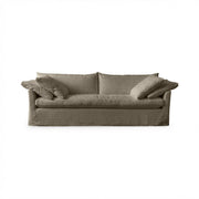 Classic Home Cassiano slip cover sofa in beige fabric, stationary sofa with plush cushions and tailored slip cover design.