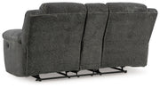 Signature Design by Ashley reclining living room set with plush sofas and loveseats, featuring comfortable reclining seats and modern style.