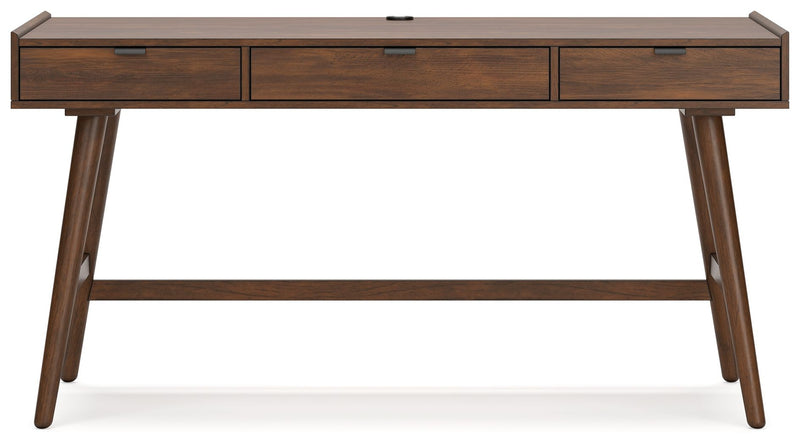 Signature Design by Ashley Lyncott home office desk with spacious surface and modern wood finish for writing and work tasks.