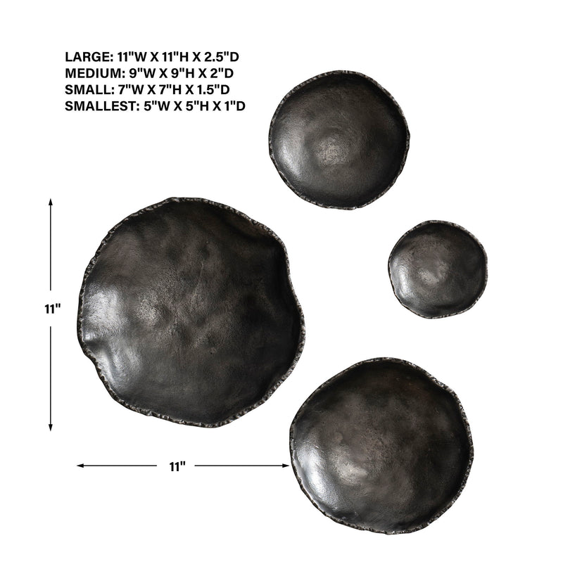 Set of four Uttermost Lucky Coins wall decor bowls with intricate metallic designs, mounted on a neutral background.