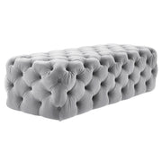 TOV Furniture Kaylee velvet ottoman with plush upholstered surface and modern design, placed in a stylish living room setting.