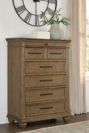 Medium brown Karallin seven drawer chest by Signature Design Ashley®, featuring sleek accent chest with ample storage and modern style.