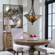 Uttermost Vitalia 3-Light Pendant in Oil Rubbed Bronze hanging with three glass shades for stylish pendant lighting.