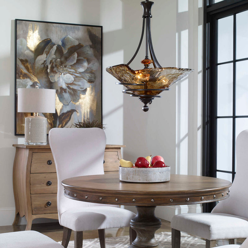 Uttermost Vitalia 3-Light Pendant in Oil Rubbed Bronze hanging with three glass shades for stylish pendant lighting.
