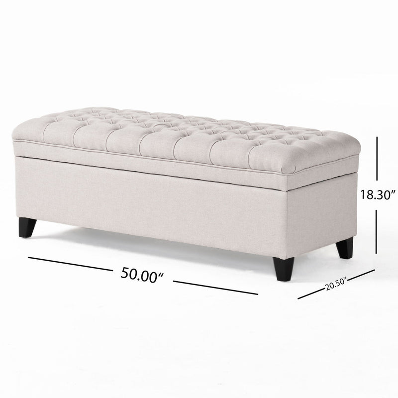 Noble House Juliana storage ottoman with beige fabric, birch wood legs, and a cushioned top for versatile living room seating.