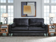 Signature Design by Ashley Bryceview onyx stationary sofa with plush cushions and sleek fabric upholstery, ideal for modern living rooms.