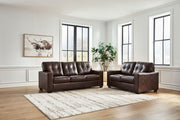 Signature Design by Ashley Santorine living room set with stationary chair and ottoman, showcasing plush upholstery and modern style.