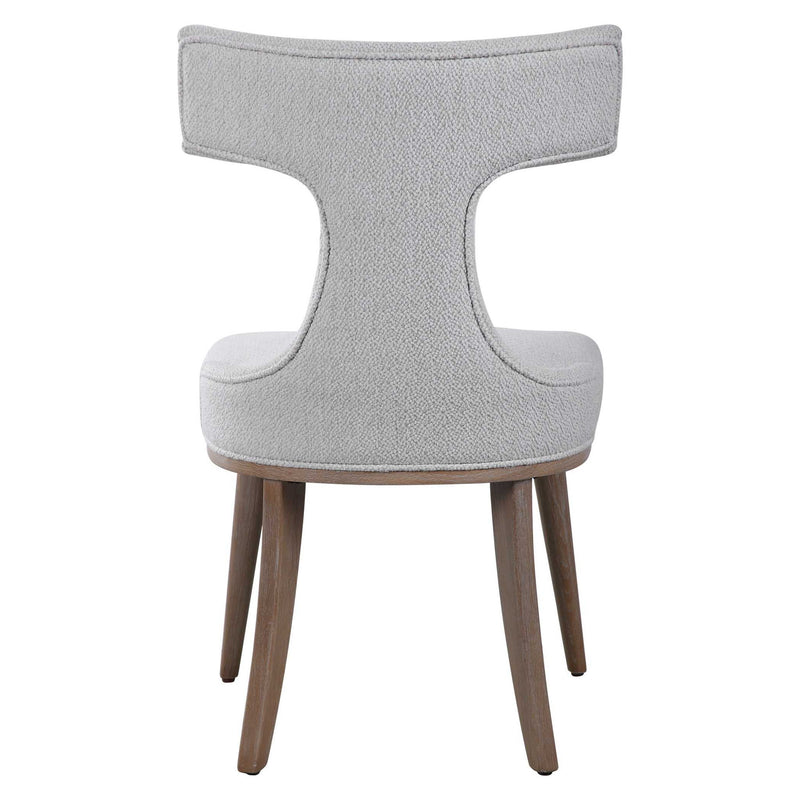Pair of white Uttermost Klismos accent chairs with curved wooden legs and elegant design, set of two for stylish seating.