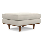 Simpli-Home Morrison handcrafted upholstered ottoman with plush fabric and wooden legs, versatile and stylish for living room decor.