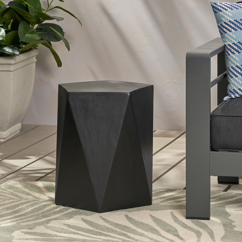 Noble House side table with geometric design, featuring a sleek, modern look and a round tabletop with angular leg accents.