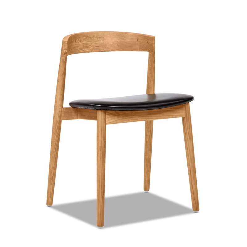 Raven - Stacking Sculpted Oak Dining Chair - Warm Natural Brown / Black - R&R Furniture Gallery (Fountain Valley, CA)