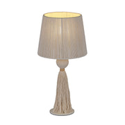 TOV Furniture Samba table lamp with a sleek modern design and a cylindrical shade, placed on a wooden surface.