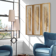 Set of three Uttermost Palma leaf shadow box wall decor in gold, featuring intricate leaf designs for stylish home decoration.