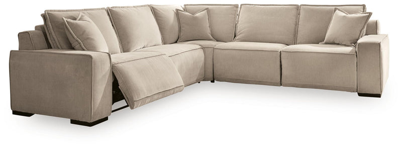 Benchcraft Carceri reclining sectional sofa with plush cushions and reclining features, shown in a modern living room setting.