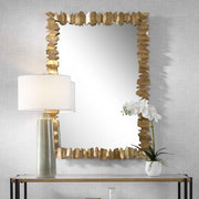 Gold accent mirror by Uttermost featuring a sleek, round design with a smooth gold frame, perfect for modern interior decor.