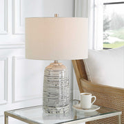 Uttermost Cyclone ivory table lamp with textured base and fabric shade, ideal for modern or classic home decor.