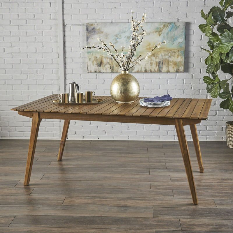 Outdoor teak dining table with sturdy frame, ideal for patio or garden outdoor dining spaces by Noble House.