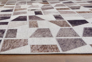Signature Design by Ashley Jettner area rug with geometric pattern in neutral colors, showcasing soft pile and modern style.