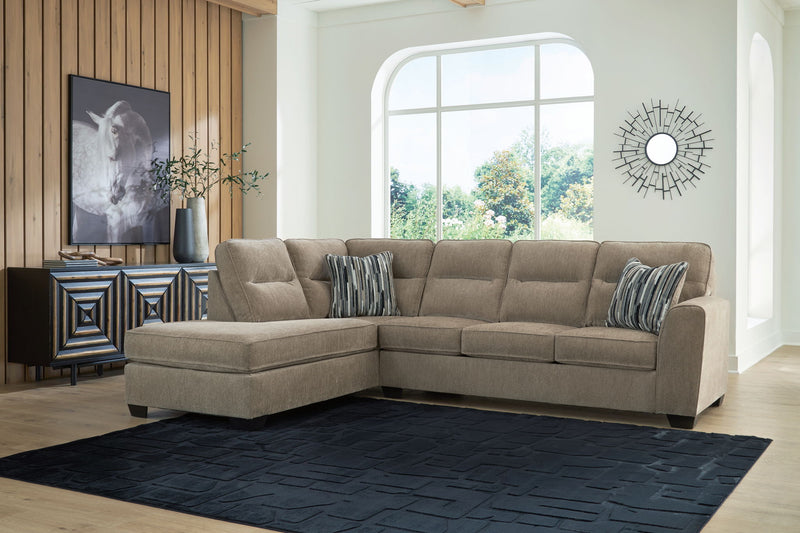 Benchcraft Olten stationary sectional sofa with plush cushions and modern design, perfect for stylish living room seating.