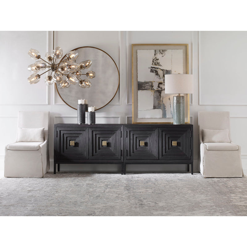 Uttermost Coley armless side chair with upholstered seat and wooden legs, modern design perfect for living or dining spaces.