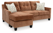 Benchcraft Amity Bay sofa chaise sleeper with plush fabric, showing the convertible design and comfortable sleeper feature.