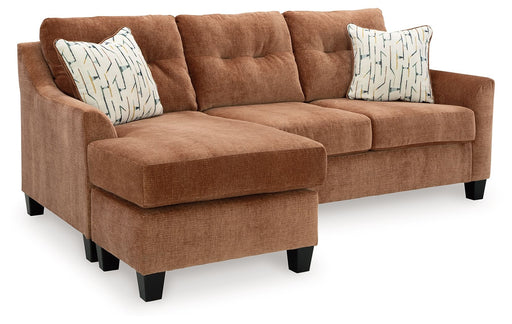 Benchcraft Amity Bay sofa chaise sleeper with plush fabric, showing the convertible design and comfortable sleeper feature.