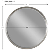 Uttermost Serenza round wall mirror with silver frame, reflecting light and adding modern elegance to interior decor.