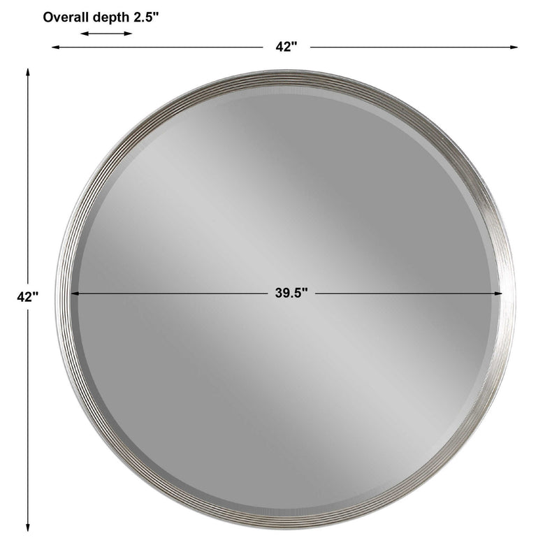Uttermost Serenza round wall mirror with silver frame, reflecting light and adding modern elegance to interior decor.