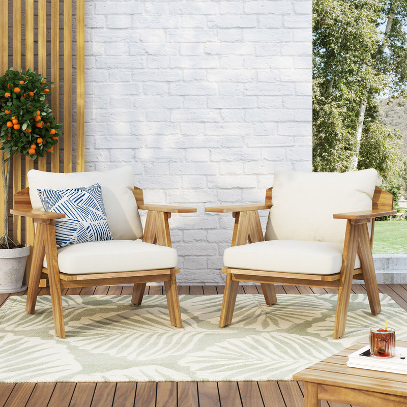 Set of two outdoor acacia wood club chairs with beige cushions, teak finish, by Noble House for patio or garden seating.