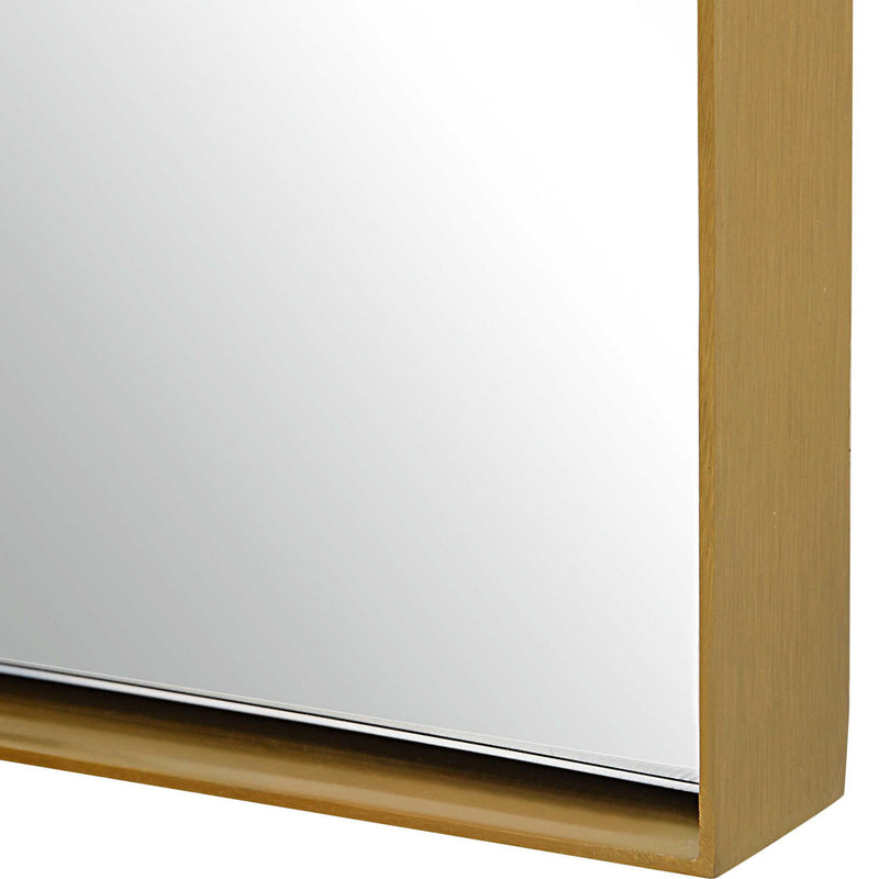 Crosley Arch Wall Mirror in antique brass finish with a sleek, curved design, by Uttermost.