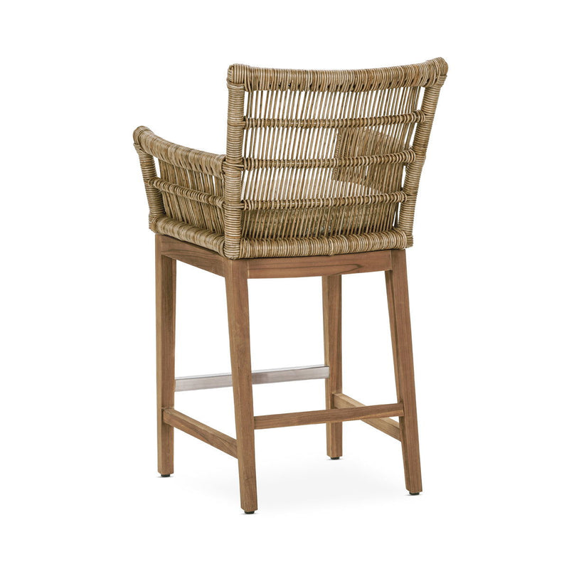 Counter height Valerie stool by Classic Home with wooden legs and upholstered seat, ideal for kitchen or bar area.