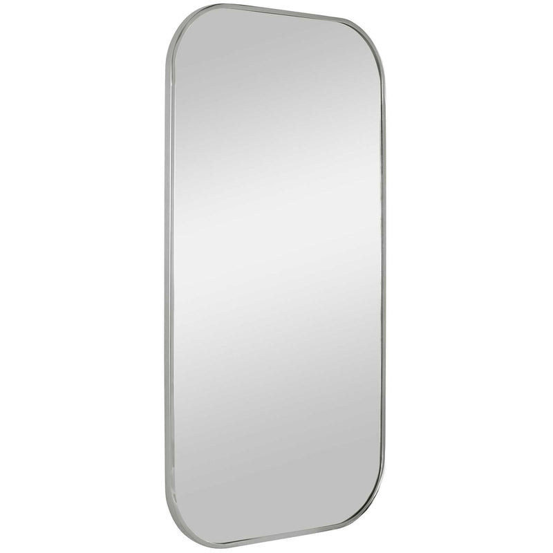 Uttermost Taft wall mirror with a sleek, modern frame, hanging on a wall, reflecting a stylish interior space.