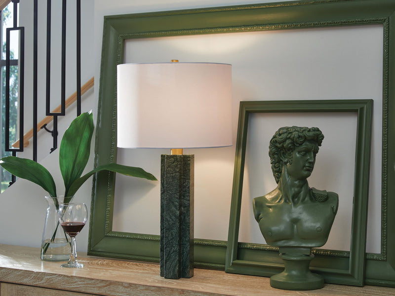 Signature Design by Ashley Keegan marble table lamp with green finish, featuring a sleek base and fabric shade for modern home decor.