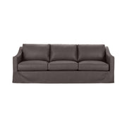 Classic Home Kipton upholstered stationary sofa with plush cushions and elegant fabric upholstery in a cozy living room setting.