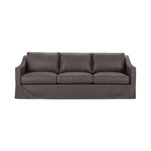 Classic Home Kipton upholstered stationary sofa with plush cushions and elegant fabric upholstery in a cozy living room setting.