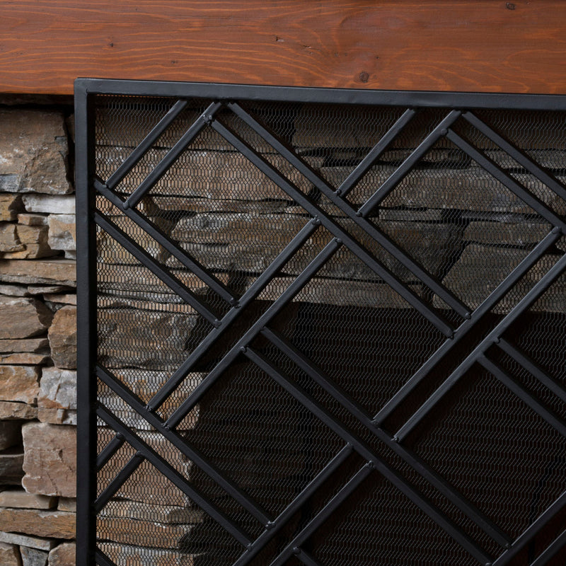 Noble House fireplace screen with elegant design and protective barrier, featuring black metal frame and decorative detailing.