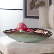 Green glaze bowl from Uttermost Iroquois collection, showcasing a smooth, glazed ceramic surface with rounded edges.