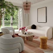 Leonie beige faux shearling stationary sofa by TOV Furniture, with plush fabric and modern design, shown in a cozy living room setting.