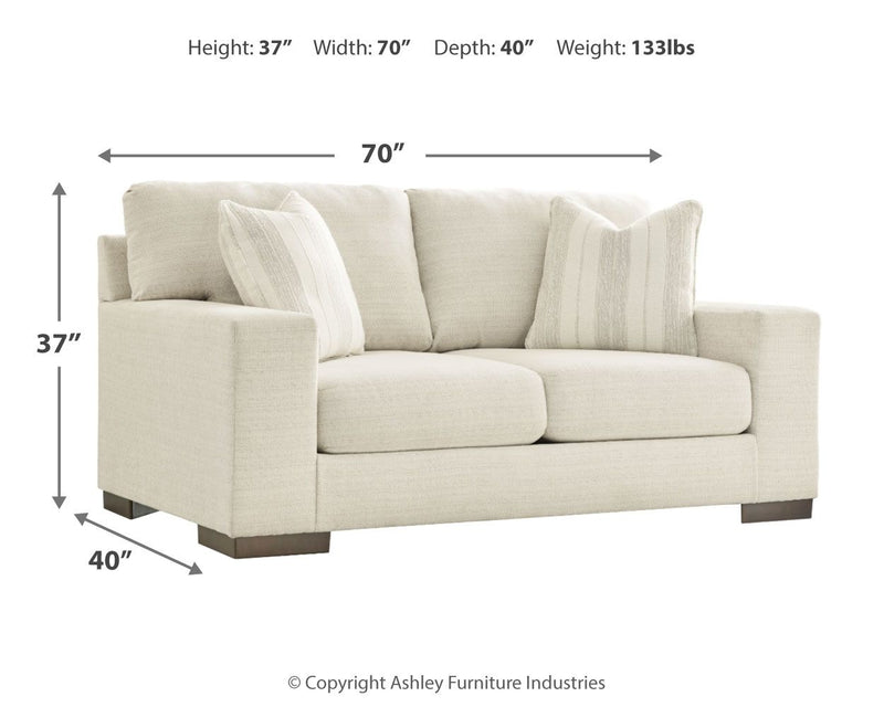 Signature Design by Ashley Maggie stationary loveseat with plush upholstery and sleek design, perfect for cozy living spaces.